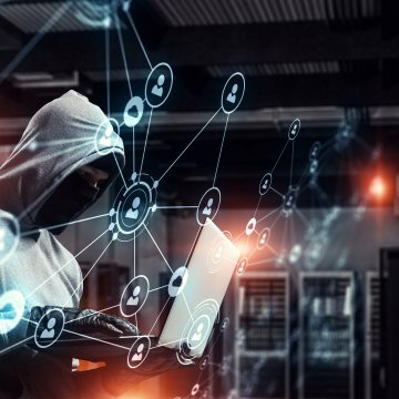 identity theft protection service identity guard family plan man in hoodie on laptop 